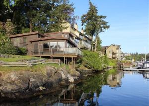 a house sitting on the side of a river at Friday Harbor Lights in Friday Harbor