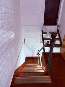 a staircase in a building with a stair case at Western Castle Stay n lawn in Coimbatore