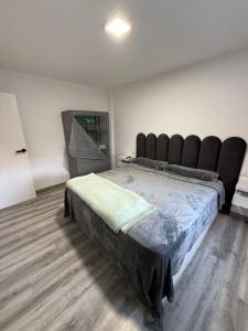 En eller flere senge i et værelse på Alojamiento confort