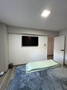 En eller flere senge i et værelse på Alojamiento confort