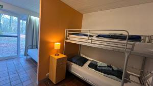 Кровать или кровати в номере Ceder 9 Hengelhoef