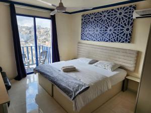 Postel nebo postele na pokoji v ubytování citadel mountain sun guest house