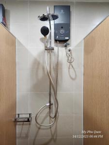 a shower in the corner of a bathroom at Mi Amor Luxury Hostel located in South Island Center in Phu Quoc