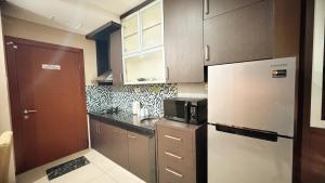 Η κουζίνα ή μικρή κουζίνα στο Good View at Thamrin Residence Apartment