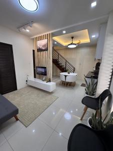 a living room with a tub and a table at Kugi Hostel - Self Check-in Capsule Hostel near Cebu Airport in Cogon +6 photos