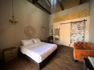 Giường trong phòng chung tại Pringamosa hotel boutique