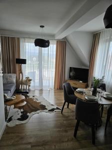 TV a/nebo společenská místnost v ubytování Apartament Ruczaj