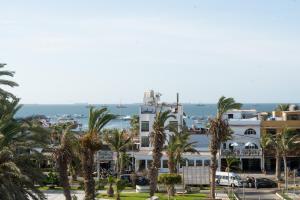 a view of a city with palm trees at Hostal 3 Lunas in Paracas