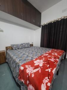 Postel nebo postele na pokoji v ubytování Pranavam Home Stay