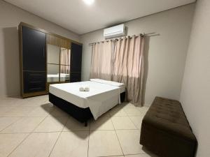 En eller flere senge i et værelse på Foz do iguaçu itaipu