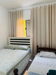 Postel nebo postele na pokoji v ubytování Aconchego econômico