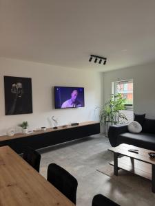 Et tv og/eller underholdning på Apartamenty Cegielnia 1 Lux-Haus