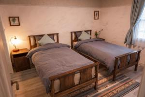 En eller flere senge i et værelse på comma, here