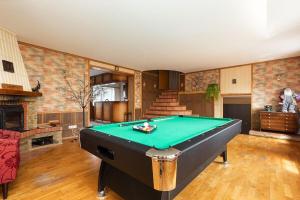 a living room with a pool table in it at Urusel Hostel in Tallinn