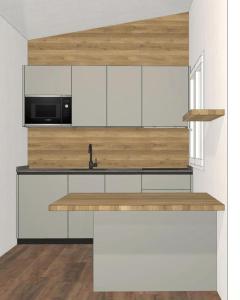 uma cozinha com armários brancos e um micro-ondas em Casa Reiner em Bondone