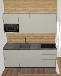 uma cozinha com armários brancos, pia e micro-ondas em Casa Reiner em Bondone