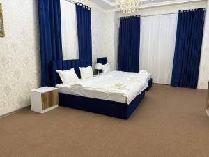 Postel nebo postele na pokoji v ubytování Velvet Hotel