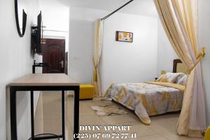 En eller flere senge i et værelse på Divin Appart