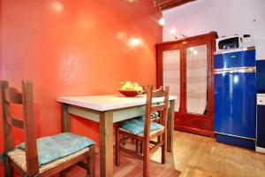 a kitchen with a table and chairs and a refrigerator at Charming and Cozy House in Florence in Florence +13 photos