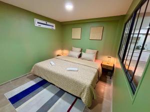 Ένα ή περισσότερα κρεβάτια σε δωμάτιο στο Le Cocon Vert