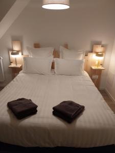 Postel nebo postele na pokoji v ubytování Sous un ciel de somme