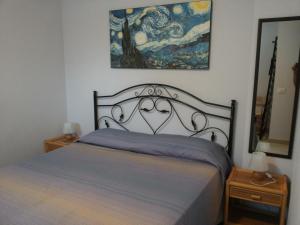A bed or beds in a room at Casa Marife'