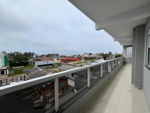 a balcony with a view of a city at Residencial Lazzari Apto 302 in Arroio do Sal