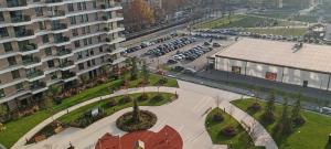 an aerial view of a parking lot with cars parked at Planet-A1012 in Niš +94 photos