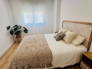 Postel nebo postele na pokoji v ubytování RÍA LIVING - Mar 03