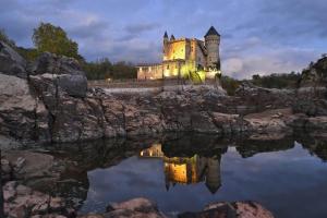 an castles reflection in the water at night at A ma campagne in Savigneux
