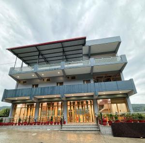 a large building with a lot of windows at Rivana Retreat in Dehradun