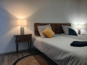 Giường trong phòng chung tại Les Terrasses du Verger +16 ảnh