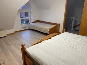 Voodi või voodid majutusasutuse Kleines Ferienhaus in Lauenburg toas