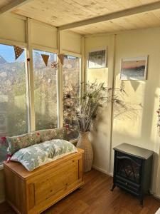 a room with a bed and a fireplace and a window at The Apple Press - Sweethay in Taunton
