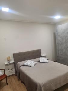 Ένα ή περισσότερα κρεβάτια σε δωμάτιο στο Casa Antonella