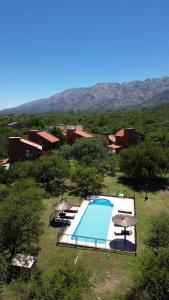 an overhead view of a swimming pool in a field at Complejo los Espinillos de Merlo in Merlo