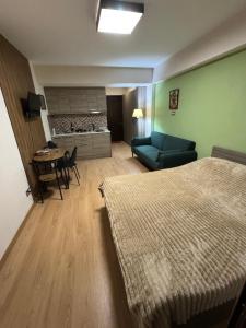 Postel nebo postele na pokoji v ubytování New Gudauri Studio