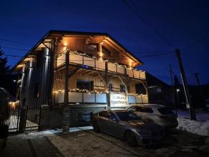 a house with a car parked in front of it at Luxusny apartman z tarasmi - Vera in Telgárt