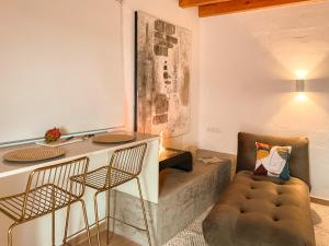 a living room with a couch and a chair at Canaryislandshost l The Sky Suites in Tinajo