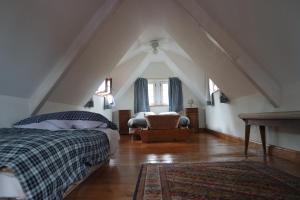 A bed or beds in a room at Le temps des cigognes