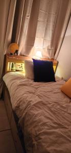 a bed in a room with a window at 베델하우스 Bethel House in Seoul