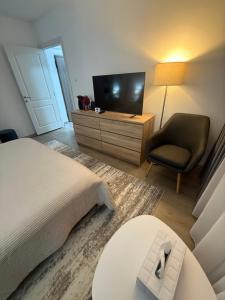 Et tv og/eller underholdning på Apart Hotel G3