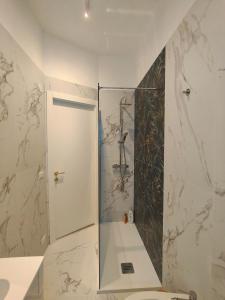 a bathroom with a shower and a toilet at Suite il Sogno in Francavilla al Mare +40 photos