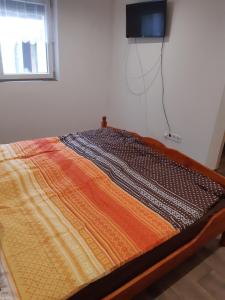 Postel nebo postele na pokoji v ubytování Tulipános Vendégház