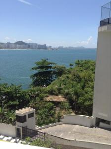 a view of the ocean from a building at Guaruja Apartment in Guarujá