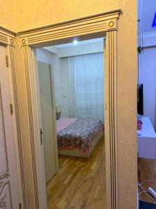 Postel nebo postele na pokoji v ubytování Kristal Abşeron