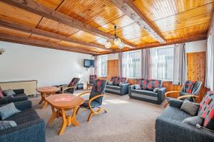a living room with couches and chairs and a table at Horská CHATA U ŠPIČÁKU in Josefuv dul