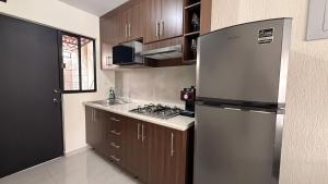 Kuchyň nebo kuchyňský kout v ubytování Altézza House