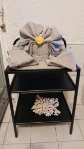 a pile of towels on top of a table with a pile of towels at Taurasteinblick in Burgstaedt