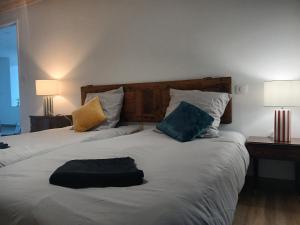 Giường trong phòng chung tại Les Terrasses du Verger